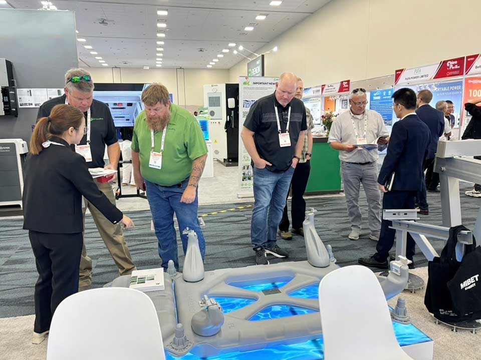 Visitors learn about products at the Mibet booth