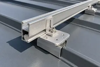 Aluminum rails held by seam clamps on the raised seams of a standing seam metal roof.