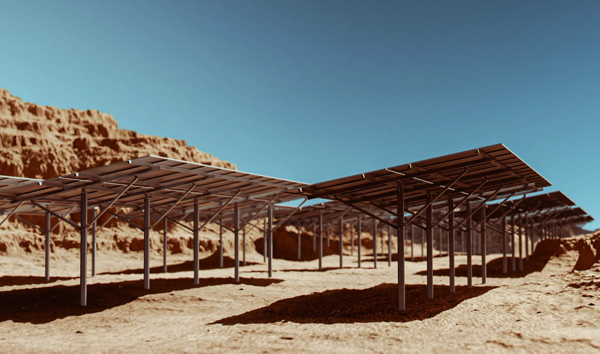 ASCE 7-compliant fixed-tilt ground mounting system for solar arrays on irregular, rocky terrain.