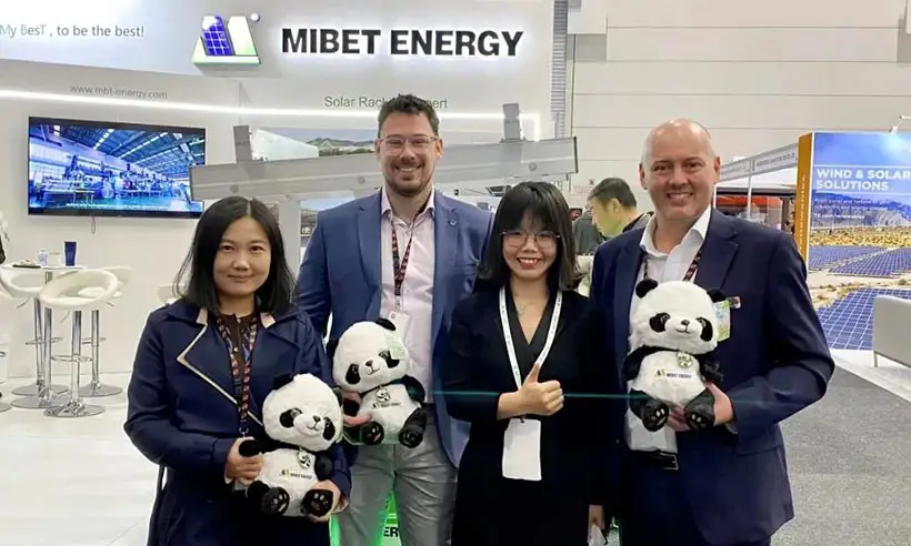 Mibet booth - group photo of employees